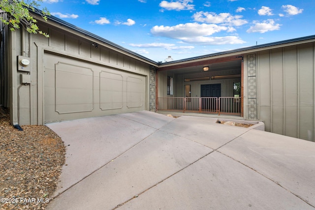 2008 Forest Hills Rd, Prescott, AZ 86303 - view of front of home featuring concrete driveway, a garage, and board and batten siding