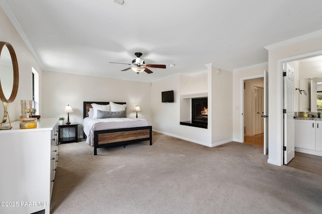 2008 Forest Hills Rd, Prescott, AZ 86303 - bedroom featuring light colored carpet, ornamental molding, a warm lit fireplace, and a ceiling fan