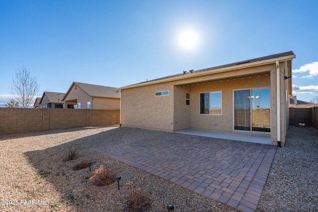 rear view of house featuring a patio