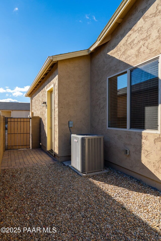 view of side of home with cooling unit