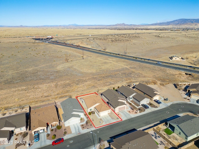 birds eye view of property featuring a mountain view