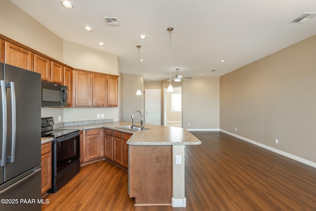 kitchen with black appliances, hanging light fixtures, sink, ceiling fan, and dark hardwood / wood-style floors