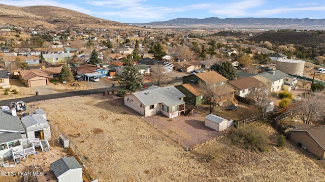 birds eye view of property with a mountain view