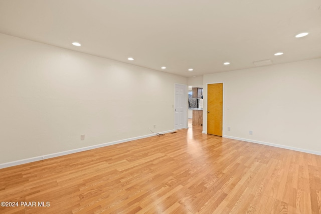 spare room with light wood-type flooring