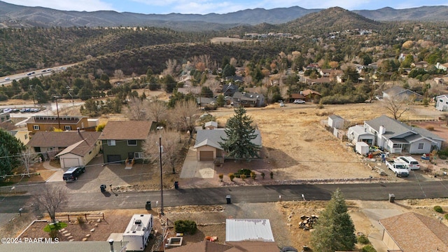 birds eye view of property with a mountain view