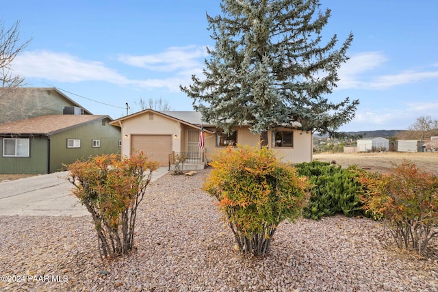 ranch-style house featuring a garage