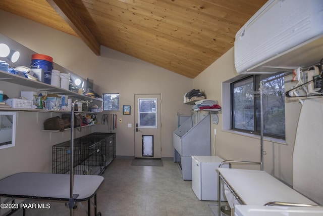 washroom with washer and dryer, wooden ceiling, laundry area, and baseboards