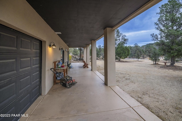 view of patio featuring a garage