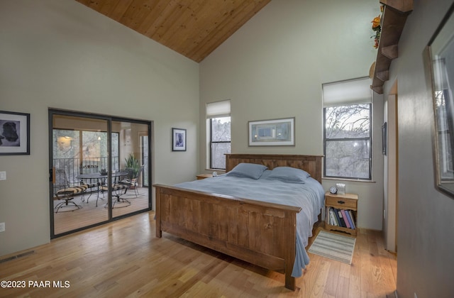 bedroom with wooden ceiling, high vaulted ceiling, access to exterior, visible vents, and light wood-style flooring