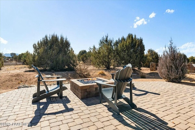 view of patio / terrace featuring a fire pit