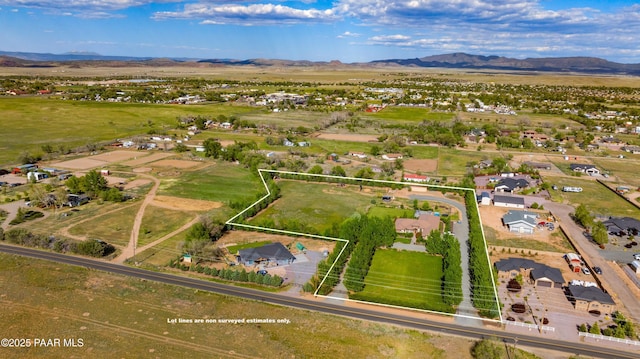 aerial perspective of suburban area featuring a mountainous background and property parcel outlined