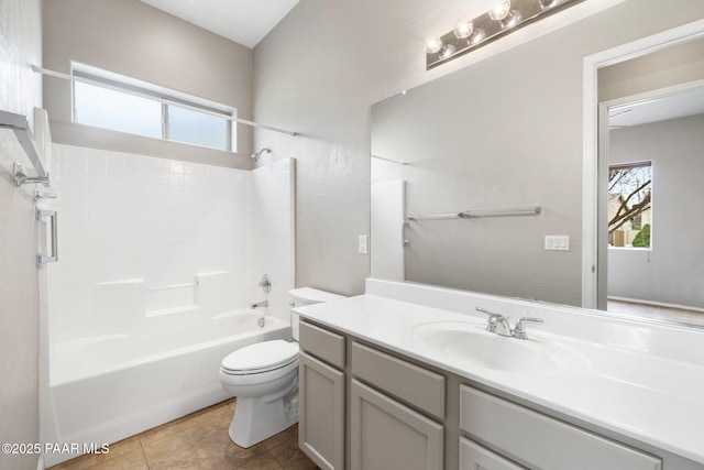 full bathroom featuring tile patterned flooring, tub / shower combination, vanity, and toilet