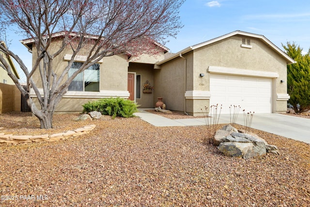 single story home with driveway, a garage, and stucco siding