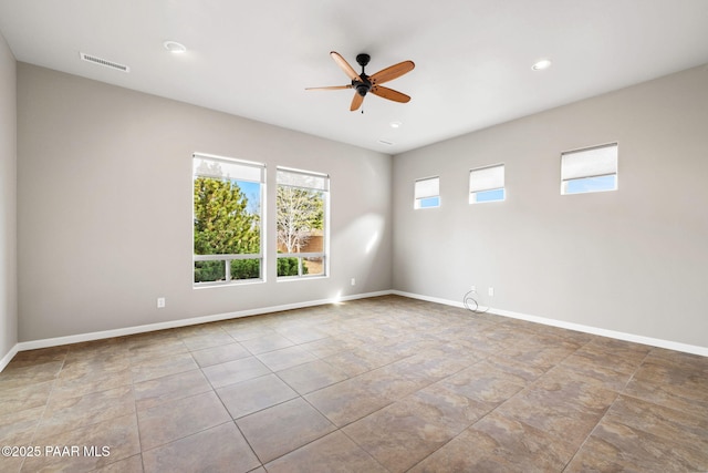 empty room featuring recessed lighting, visible vents, ceiling fan, and baseboards