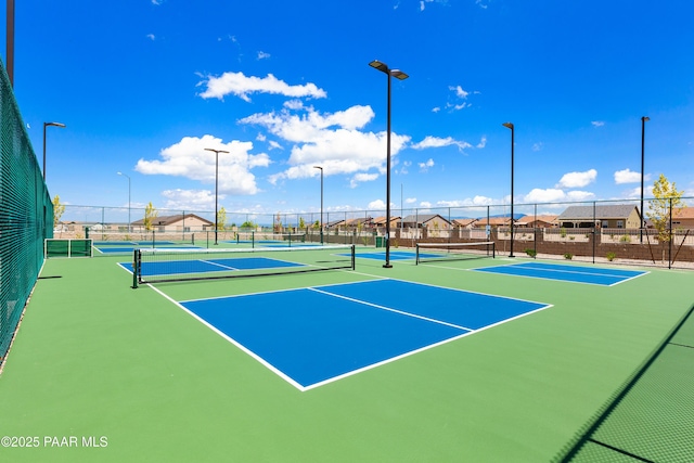 view of sport court with community basketball court and fence