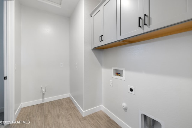 clothes washing area with cabinets, washer hookup, hookup for an electric dryer, and hookup for a gas dryer