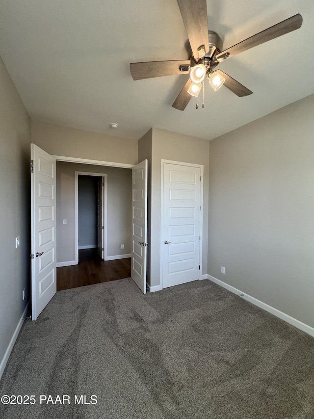 6670 E Rabbit Hole Way, Prescott Valley, AZ 86315 - unfurnished bedroom with dark colored carpet and a ceiling fan
