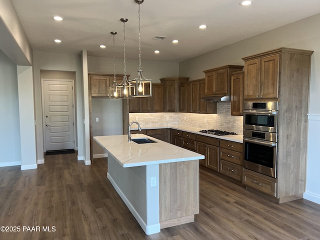 6670 E Rabbit Hole Way, Prescott Valley, AZ 86315 - kitchen with appliances with stainless steel finishes, dark wood-style flooring, tasteful backsplash, and recessed lighting
