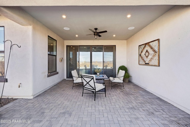 view of patio / terrace with outdoor dining area and a ceiling fan