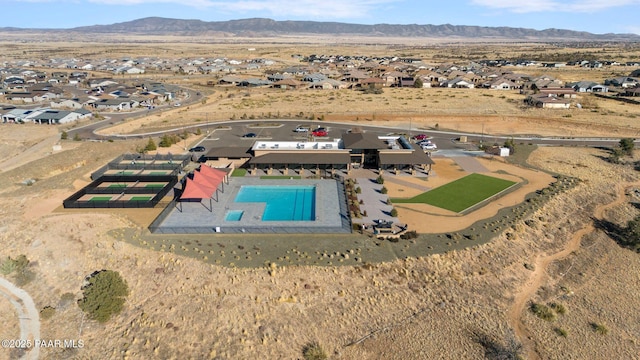 birds eye view of property featuring a mountain view