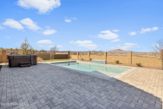 view of swimming pool with a fenced in pool, a patio area, a fenced backyard, and a hot tub