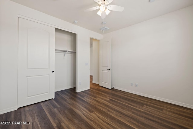 7912 Huckleberry Trl, Prescott Valley, AZ 86315 - unfurnished bedroom with dark wood finished floors, baseboards, a closet, and a ceiling fan