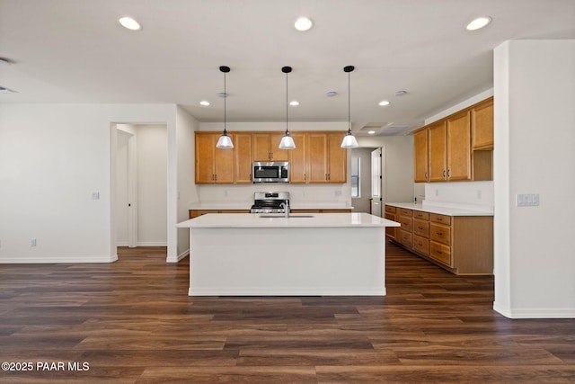 7912 Huckleberry Trl, Prescott Valley, AZ 86315 - kitchen with appliances with stainless steel finishes, brown cabinetry, baseboards, and recessed lighting