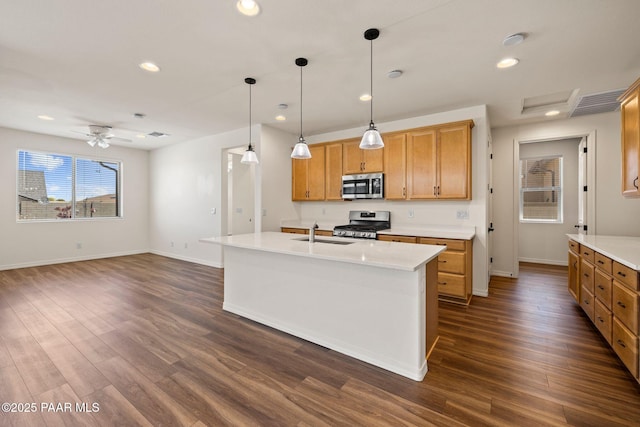 7912 Huckleberry Trl, Prescott Valley, AZ 86315 - kitchen with stainless steel appliances, a sink, baseboards, dark wood-type flooring, and recessed lighting