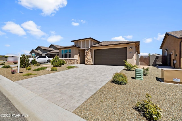 7912 Huckleberry Trl, Prescott Valley, AZ 86315 - view of front of property featuring decorative driveway, a gate, a garage, and stucco siding