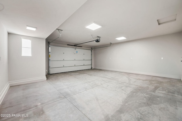 garage featuring baseboards and a garage door opener