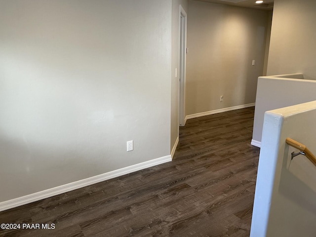 corridor with dark hardwood / wood-style floors