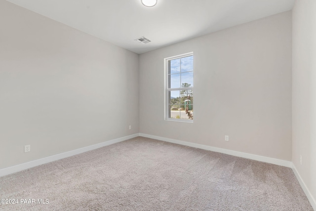 unfurnished room with carpet flooring