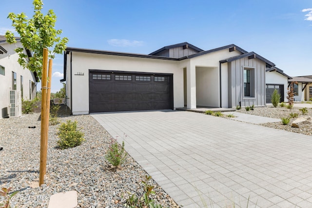 modern inspired farmhouse featuring a garage