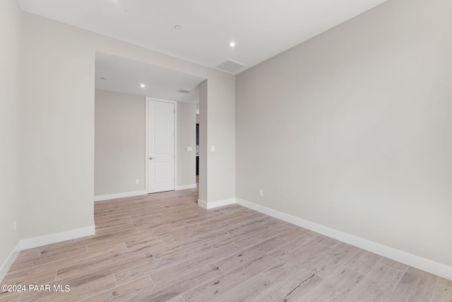 unfurnished room featuring light hardwood / wood-style floors