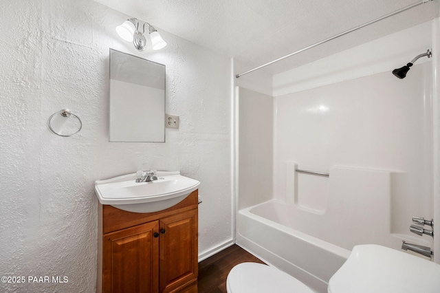 234 N Arizona Ave, Prescott, AZ 86301 - full bath featuring toilet, a textured wall, vanity, shower / washtub combination, and wood finished floors