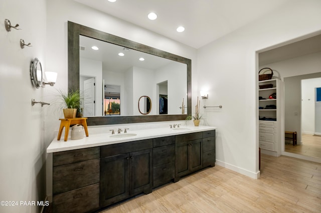 bathroom featuring vanity and wood-type flooring