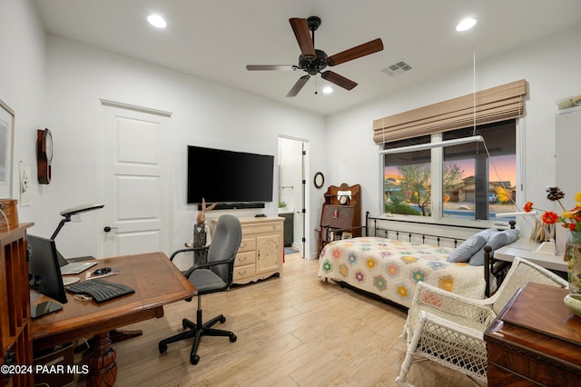 office featuring hardwood / wood-style flooring and ceiling fan