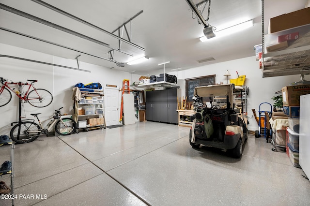 garage featuring a garage door opener