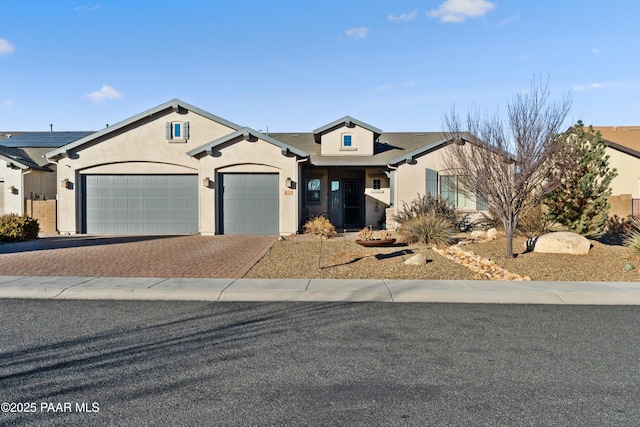 view of front of property featuring a garage