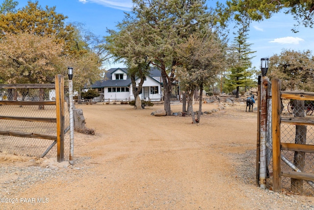 view of yard featuring fence and a gate