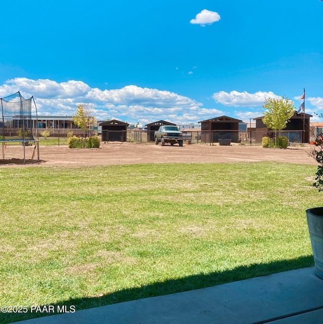 view of yard with a trampoline