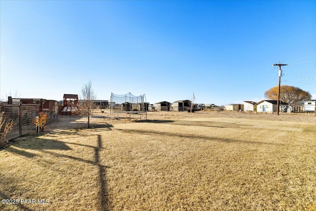 view of yard with a trampoline