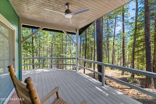 wooden terrace featuring ceiling fan