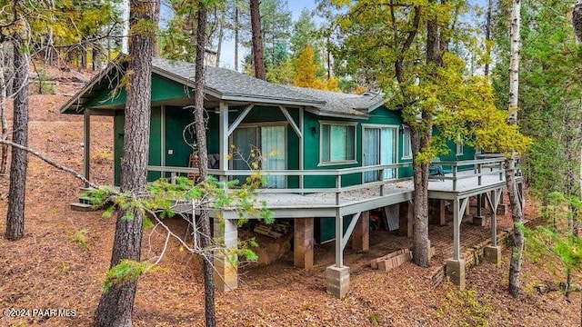 rear view of property with a wooden deck