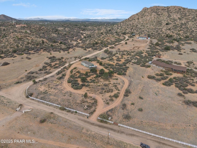 birds eye view of property featuring view of desert, a rural view, and a mountain view