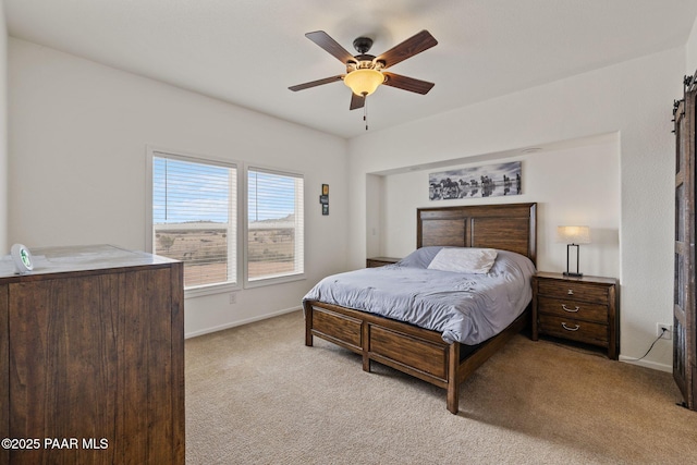 bedroom with light carpet, a ceiling fan, and baseboards