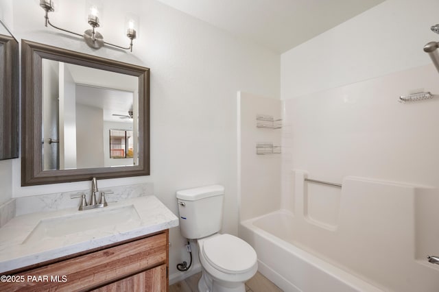 full bathroom featuring vanity,  shower combination, and toilet