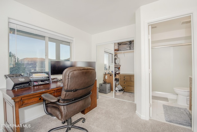 home office with light carpet