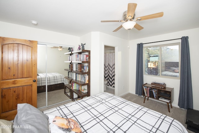 bedroom featuring ceiling fan, a closet, and dark colored carpet