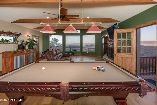 recreation room featuring ceiling fan, pool table, hardwood / wood-style floors, and vaulted ceiling with beams